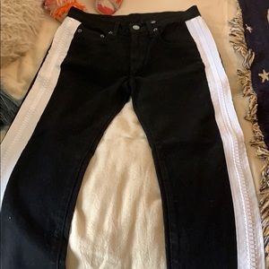 black jeans with white zippers down sides